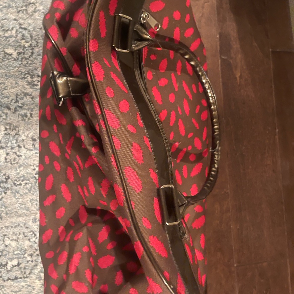 Cheeta link and brown suitcase